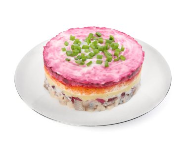 Herring under fur coat salad isolated on white. Traditional Russian dish