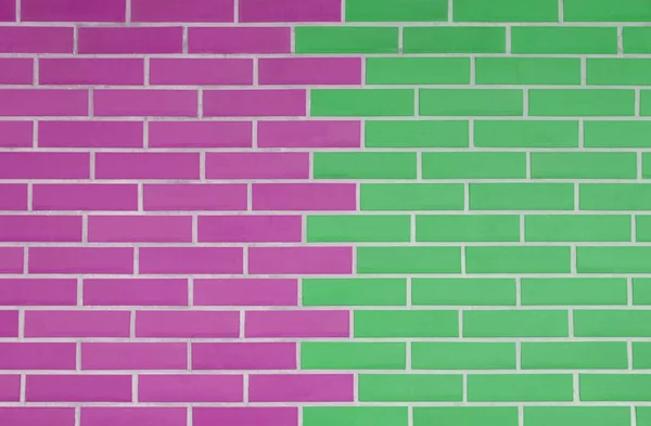 Pink and light green brick wall as background
