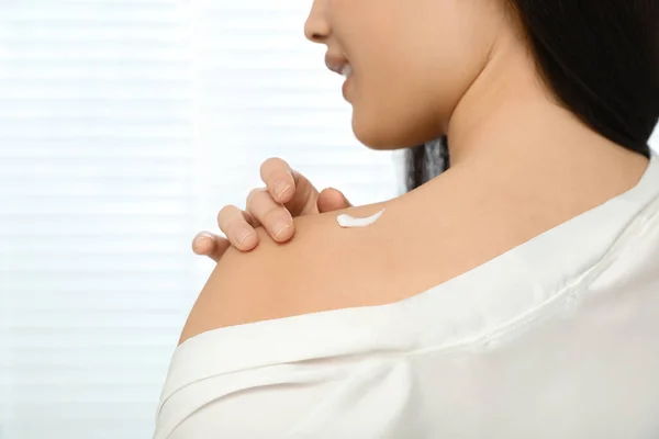 Young Woman Applying Body Cream Shoulder Indoors Closeup Space Text — Stock Photo, Image