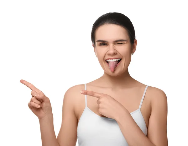 Happy Young Woman Showing Her Tongue Pointing White Background — Stock Photo, Image
