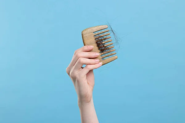 Woman Holding Comb Lost Hair Light Blue Background Closeup Alopecia — Stock Photo, Image