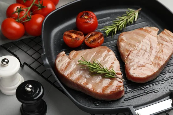 Delicious Tuna Steaks Rosemary Tomatoes Grey Table Closeup — Stock Photo, Image