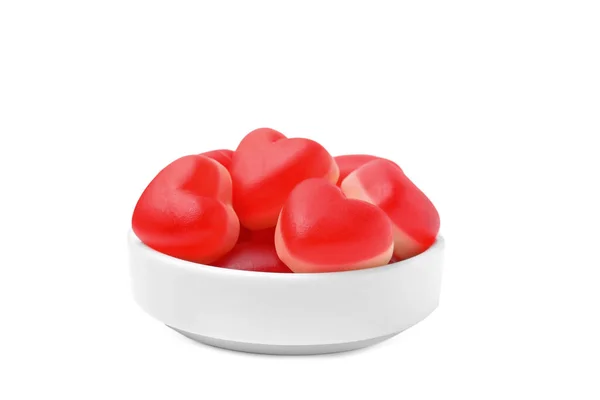 Stock image Bowl with sweet heart shaped jelly candies isolated on white