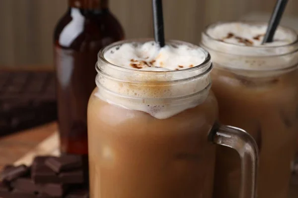 stock image Delicious iced coffee with chocolate syrup, closeup