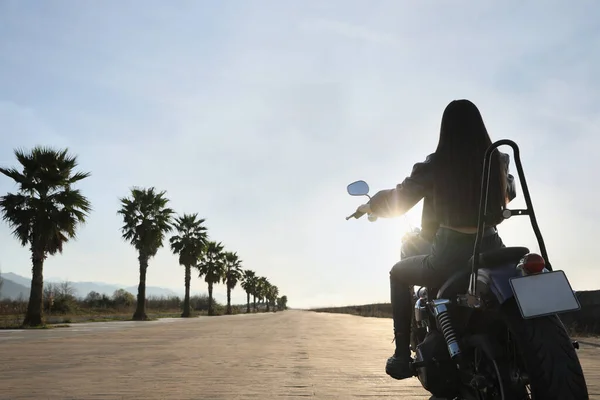 Woman Riding Motorcycle Sunset Back View Space Text — Fotografia de Stock