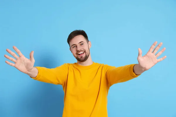 Man Giving High Five Light Blue Background — Stock Photo, Image