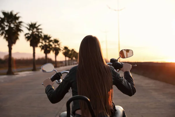 Woman Riding Motorcycle Sunset Back View — 스톡 사진