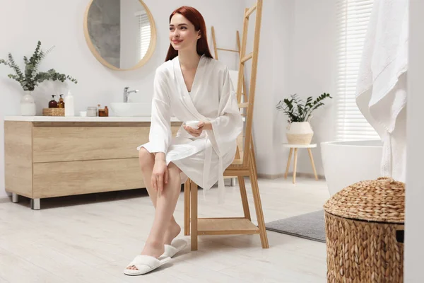 Beautiful Young Woman Applying Body Cream Leg Bathroom — Stock Photo, Image