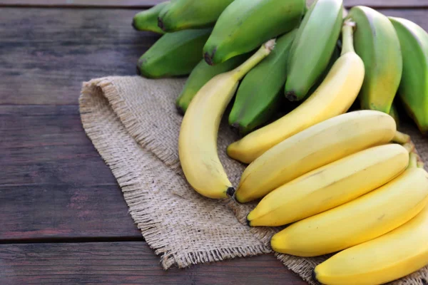 Diferentes Tipos Bananas Mesa Madeira Espaço Para Texto — Fotografia de Stock