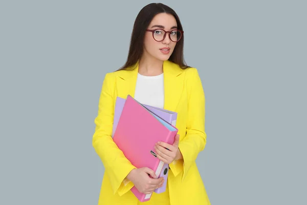 Young Female Intern Eyeglasses Folders Grey Background — Stock Photo, Image