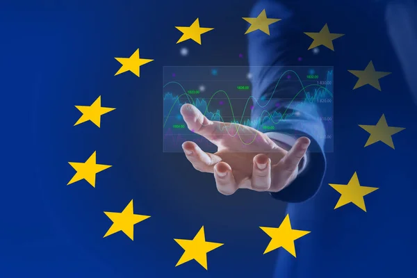 Stock exchange. Double exposure with European flag and man holding digital trading graphs