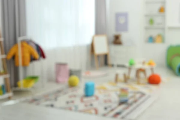 Розмитий Вид Дитячої Ігрової Кімнати Різними Іграшками Меблями Стильний Інтер — стокове фото