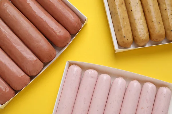 Different Vegan Sausages Yellow Background Flat Lay — Stock Photo, Image