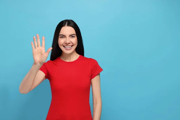 Happy Woman Giving High Five Light Blue Background Space Text — Stok Foto