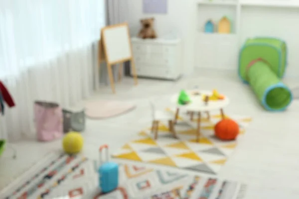 Розмитий Вид Дитячої Ігрової Кімнати Різними Іграшками Меблями Стильний Інтер — стокове фото