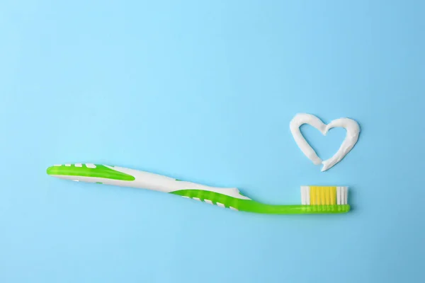 Heart Made Toothpaste Brush Light Blue Background Top View — Stock Photo, Image