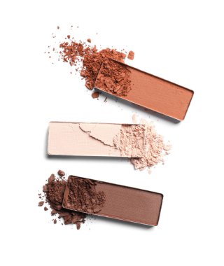 Different crushed eye shadows on white background, flat lay. Professional makeup product