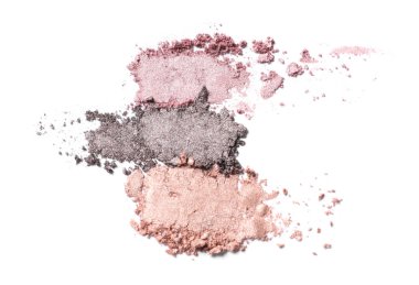 Crushed eye shadows on white background. Professional makeup product