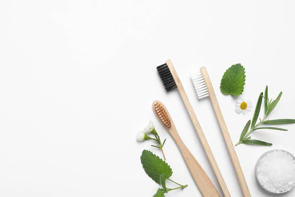 Bamboo Toothbrushes Flowers Herbs Sea Salt White Background Flat Lay — Stock Photo, Image