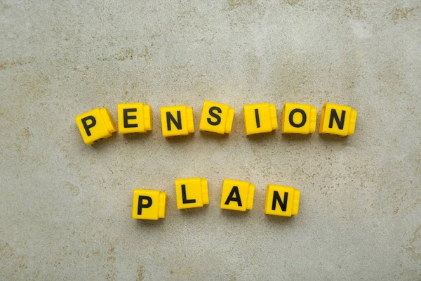 Words Pension Plan made of yellow cubes on light textured table, flat lay