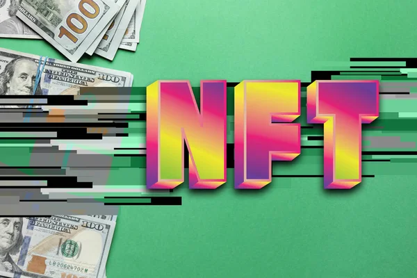 stock image Abbreviation NFT (non-fungible token) and dollar banknotes on green background, top view. Glitch effect