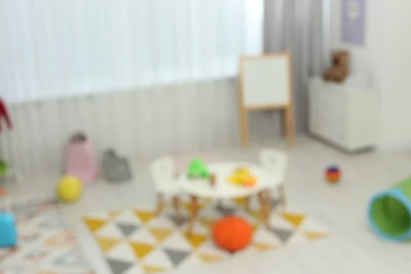Размытый Вид Детской Игровой Комнаты Различными Игрушками Мебелью Стильный Интерьер — стоковое фото