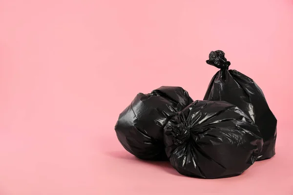 Trash Bags Full Garbage Pink Background Space Text — Foto de Stock