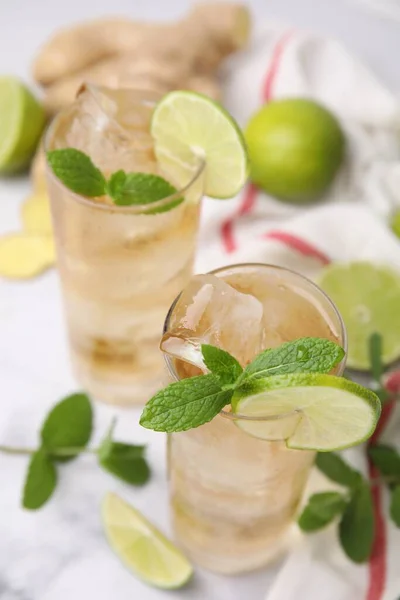 Glasses Tasty Ginger Ale Ice Cubes Lime Slices Mint Blurred — Stock Photo, Image