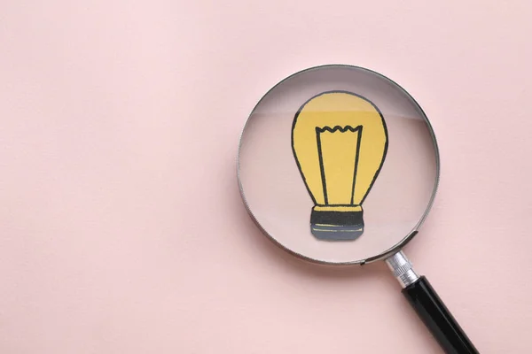 Magnifying Glass Paper Light Bulb Pink Background Top View Space — Stock Photo, Image