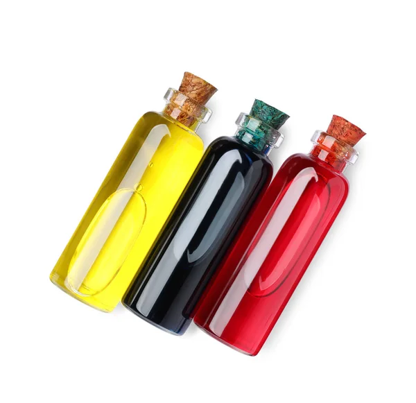 Стеклянные Бутылки Различными Пищевыми Красителями Белом Фоне Вид Сверху — стоковое фото
