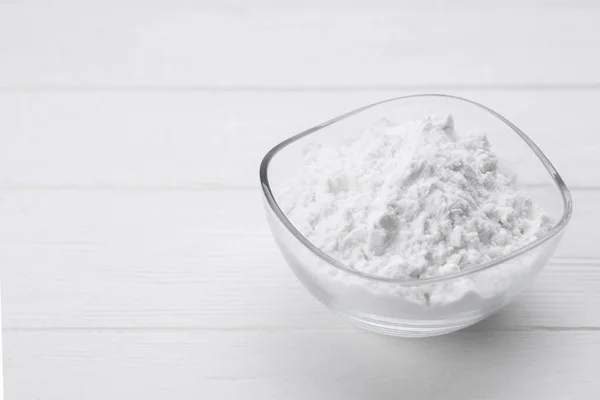 stock image Starch in bowl on white wooden table, closeup. Space for text