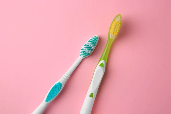New Toothbrushes Pink Background Flat Lay — Stock Photo, Image