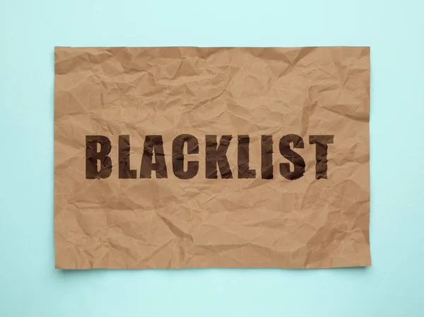 Papel Enrugado Com Palavra Blacklist Fundo Azul Claro Vista Superior — Fotografia de Stock