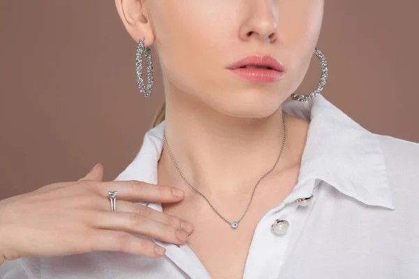 Woman Elegant Jewelry Light Brown Background Closeup — Stock Photo, Image