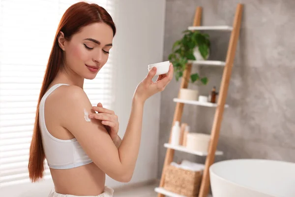 Beautiful Young Woman Applying Body Cream Shoulder Bathroom Space Text — Stock Photo, Image
