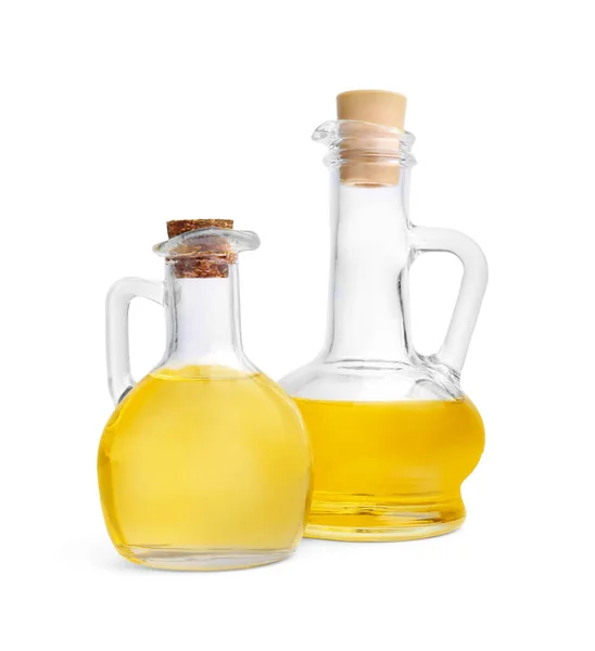 stock image Glass jugs of cooking oil on white background