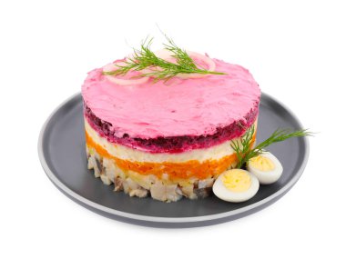 Herring under fur coat salad isolated on white. Traditional Russian dish