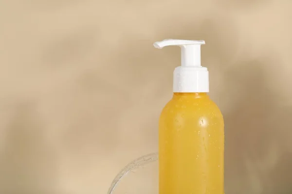 Wet Bottle Facial Cleanser Beige Background Closeup Space Text — Stock Photo, Image