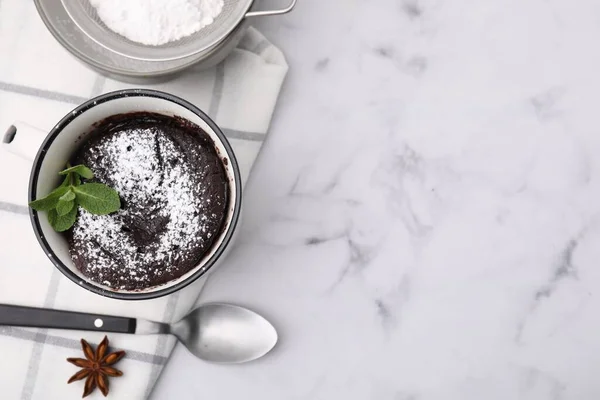 Stock image Tasty chocolate mug pie on white marble table, flat lay with space for text. Microwave cake recipe