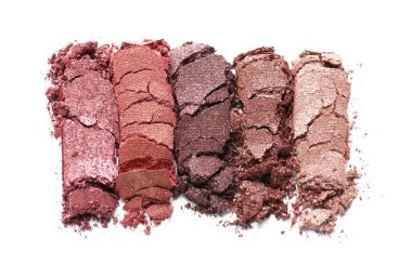 Different crushed eye shadows on white background, top view. Professional makeup product