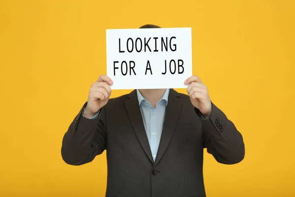 Unemployed Man Holding Sign Phrase Looking Job Orange Background — 스톡 사진