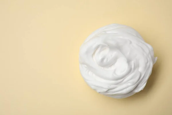 stock image Sample of shaving foam on beige background, top view. Space for text