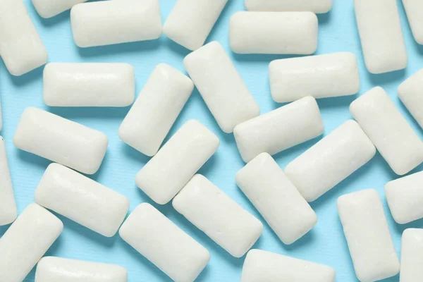 Tasty White Chewing Gums Light Blue Background Flat Lay — Zdjęcie stockowe