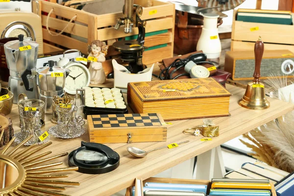 Many Different Items Wooden Table Indoors Garage Sale — Stock Photo, Image