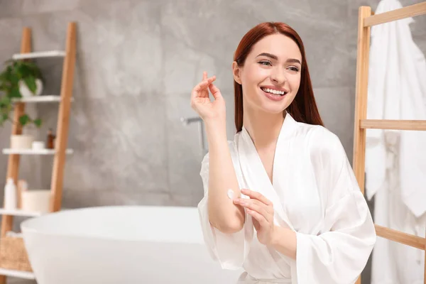Beautiful Young Woman Applying Body Cream Elbow Bathroom Space Text — Stock Photo, Image