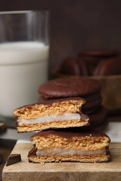 stock image Tasty choco pies on wooden board, closeup. Space for text