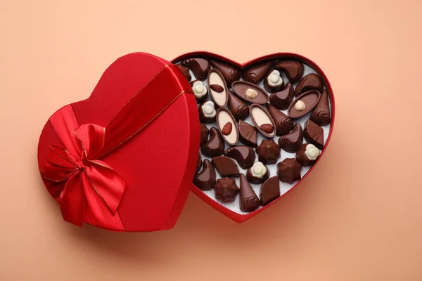 Heart Shaped Box Delicious Chocolate Candies Beige Background Top View — Fotografia de Stock