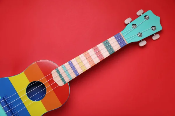 Colorful Ukulele Red Background Top View String Musical Instrument — Stock Photo, Image