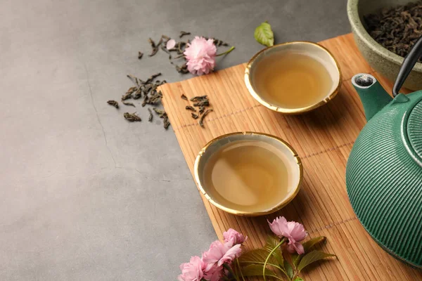Traditional Ceremony Cups Brewed Tea Teapot Sakura Flowers Grey Table — Stock Photo, Image