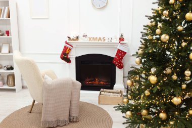 Living room interior with beautiful Christmas tree and festive decor